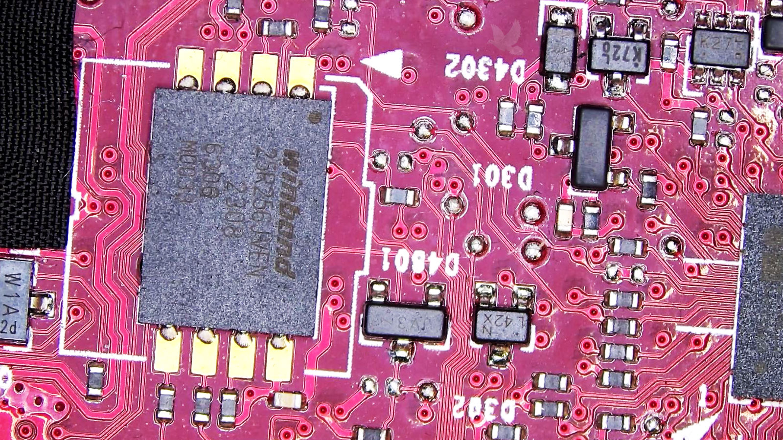Winbond BIOS chip on an ASUS ROG gaming laptop motherboard requiring reprogramming after BIOS corruption