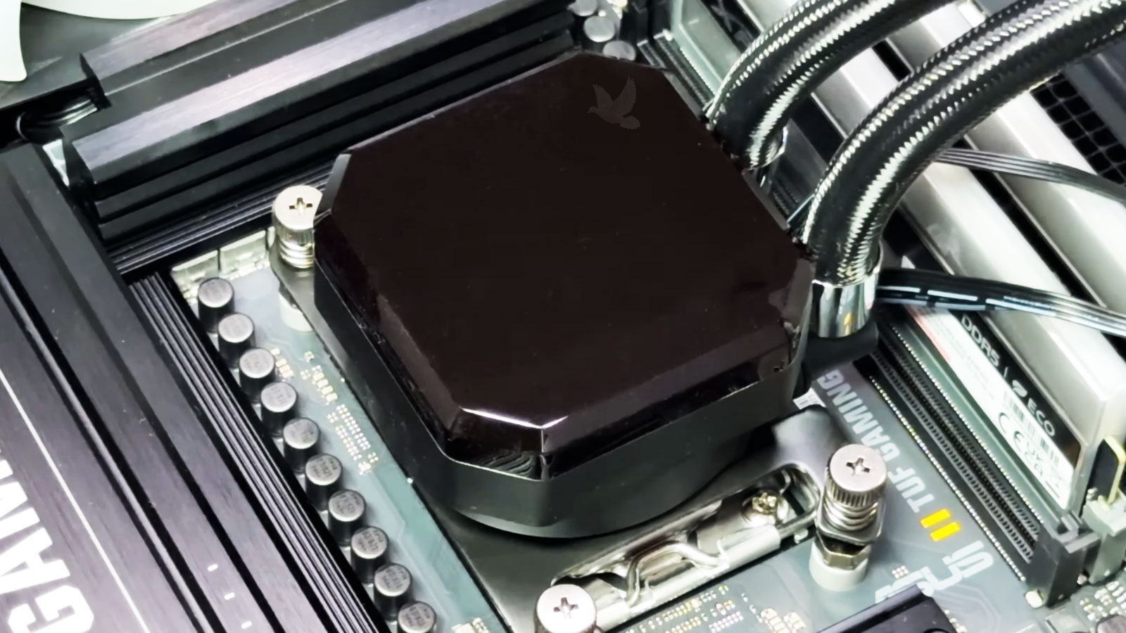 Gaming computer CPU liquid cooling pump being inspected after the cooling system stopped working