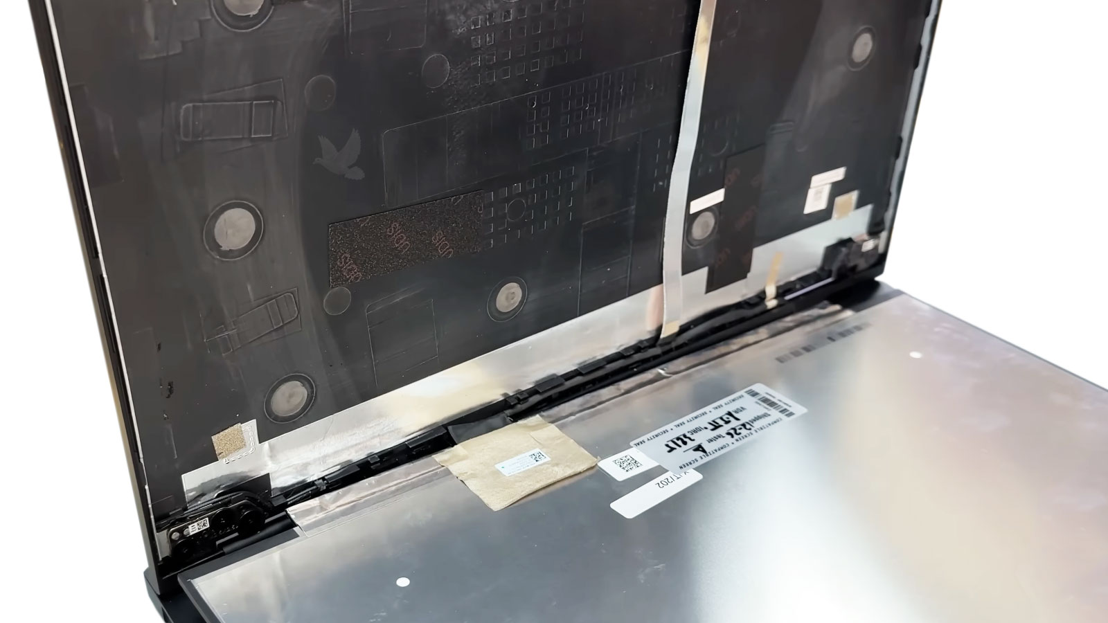 Laptop LCD screen being disconnected from the display cable during screen replacement