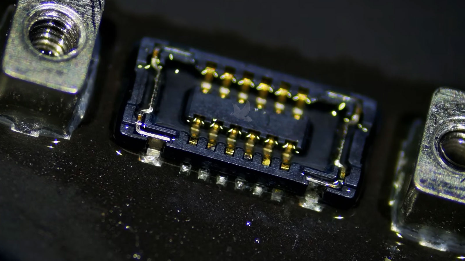 MacBook-Pro-Liquid-Damaged-Board-to-Board-Connector MacBook Pro board-to-board connector with a partially destroyed contact from liquid corrosion