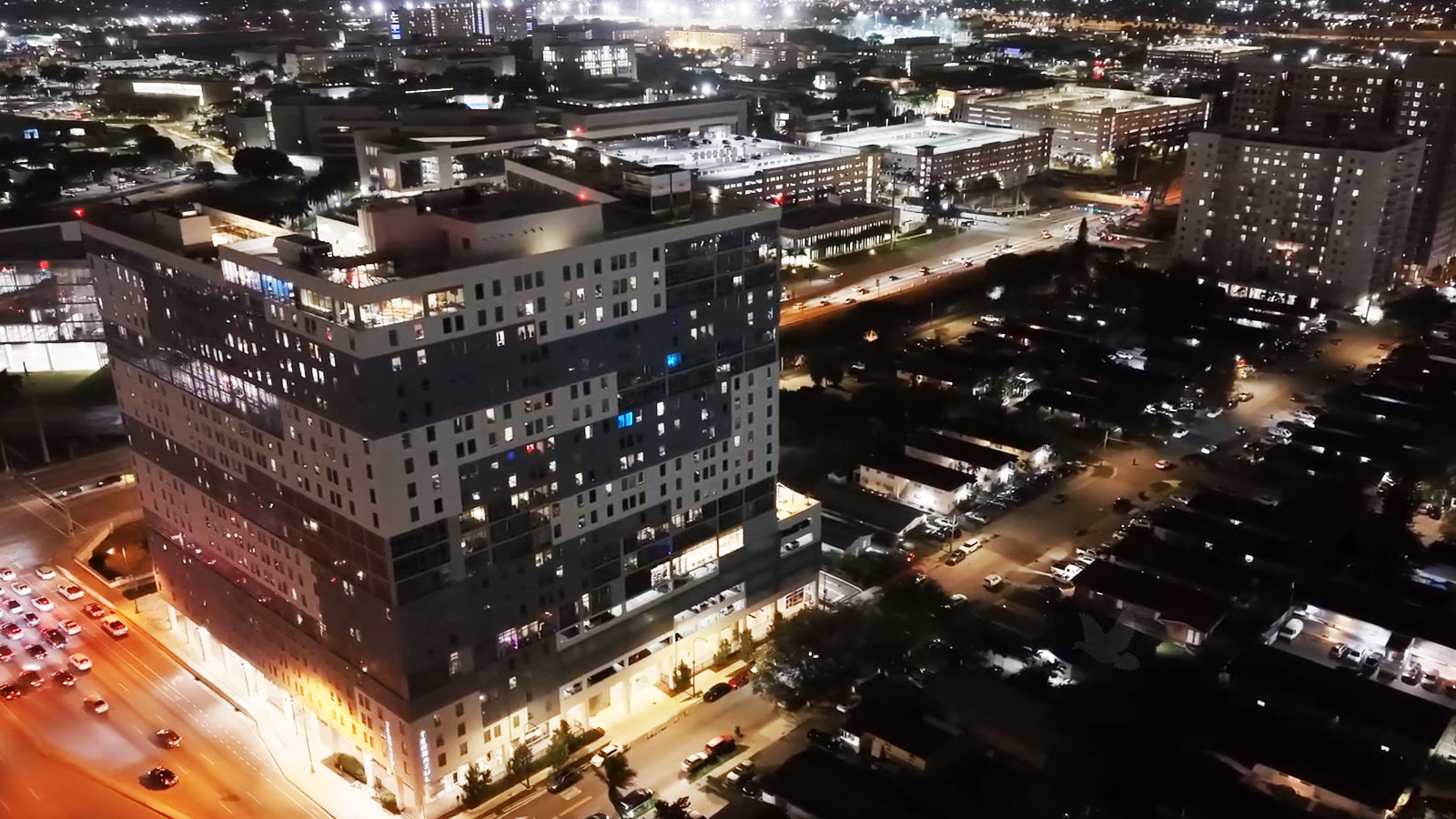 Night view of Sweetwater Florida with illuminated buildings and colorful city lights