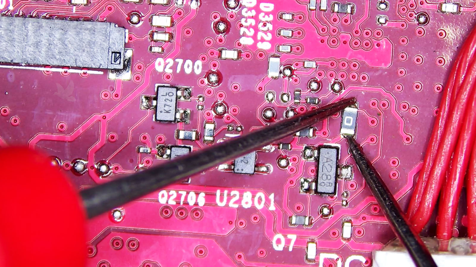 Zero-ohm resistor being measured to check for an open circuit during board-level diagnosis