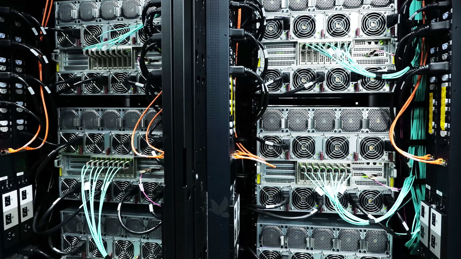 Network cables connecting two equipment racks as part of a wired network infrastructure