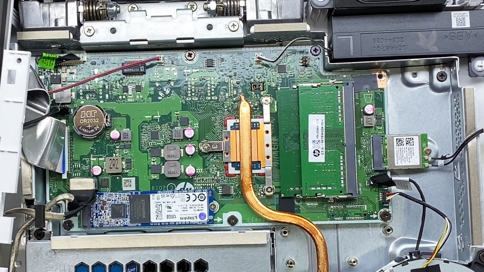All-in-one computer opened to access the M.2 SSD for direct data transfer