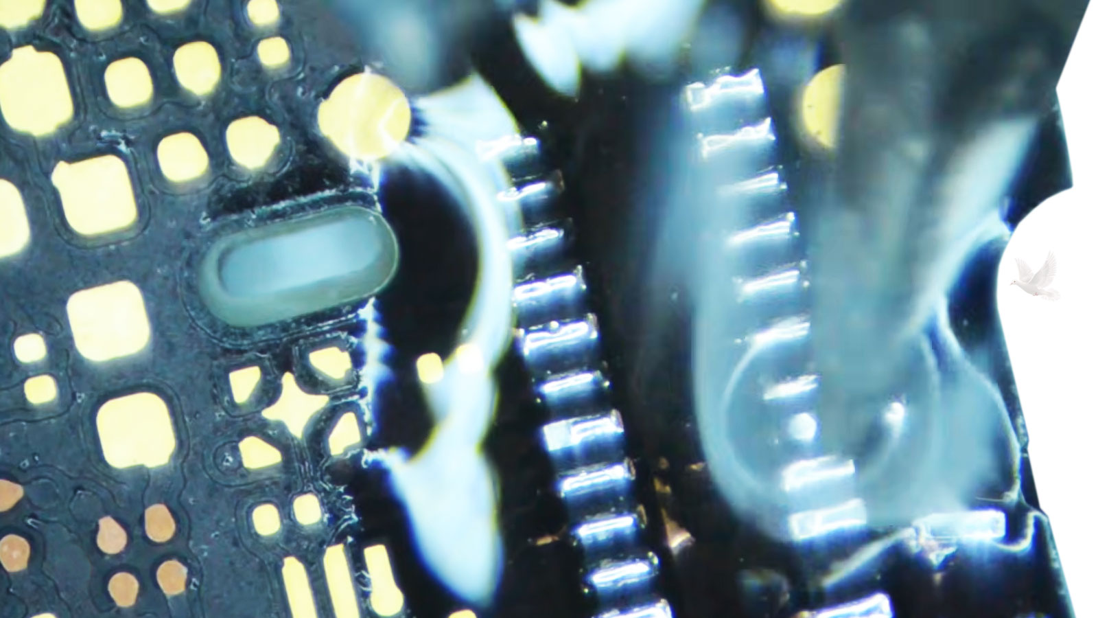 Microsoldering repair being performed on an all-in-one computer motherboard