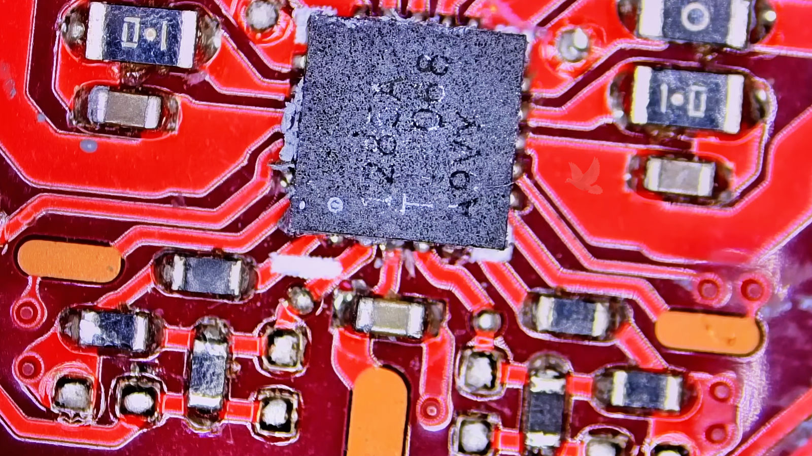 Computer-IC-Damaged-by-MOSFET-Overvoltage Damaged IC chip on a computer circuit board after a shorted MOSFET sent excessive voltage into the circuit