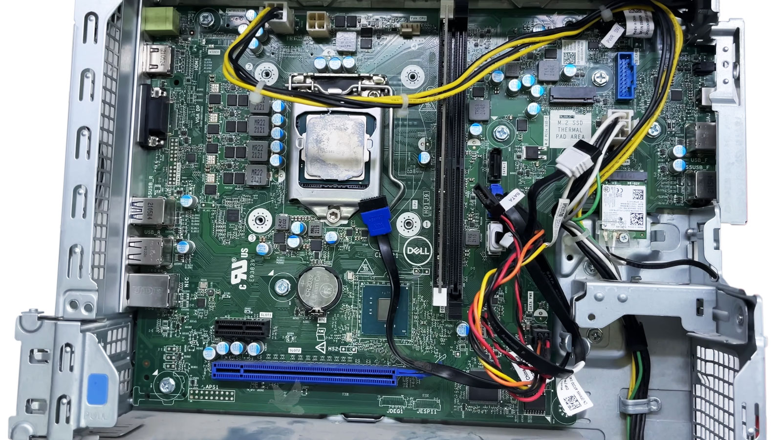 Dell desktop open on the repair bench for power path and motherboard diagnostics