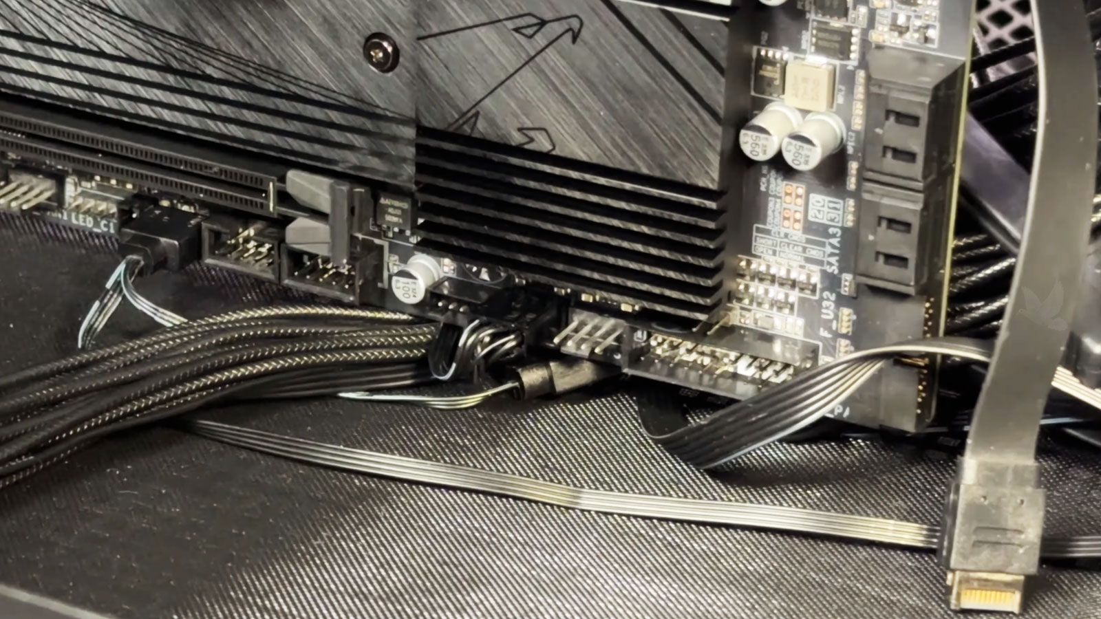 Desktop motherboard diagnosis identifying a short circuit near USB, RGB, LED, and front panel connectors