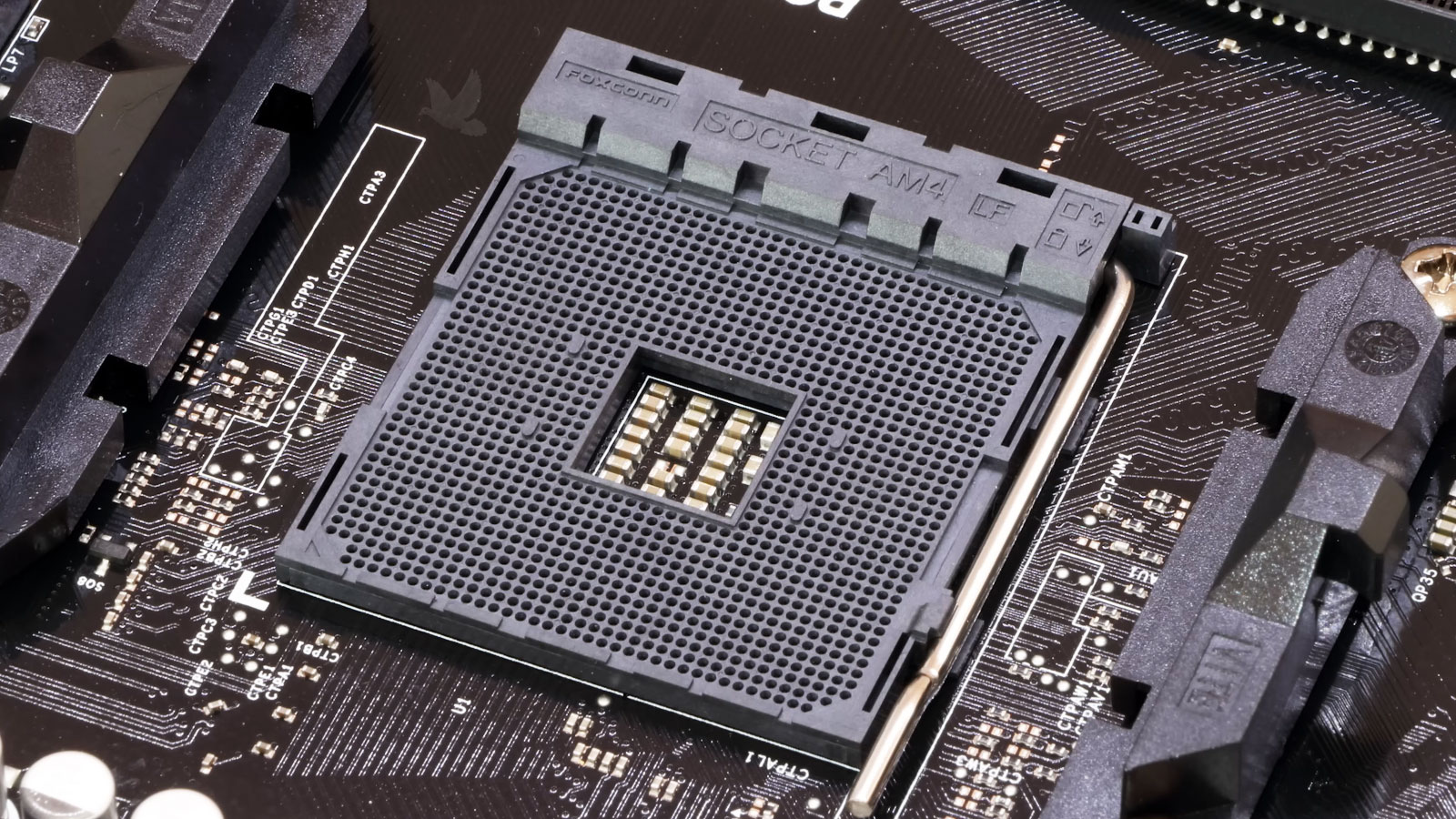 Gaming PC repair in progress tracing the hardware failure to circuitry beneath the AMD AM4 CPU socket