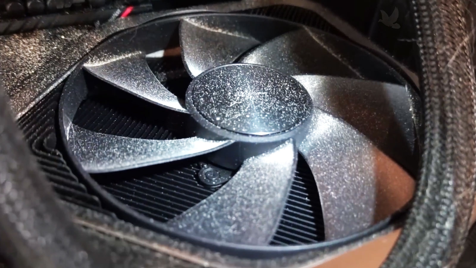 Dust-covered GeForce RTX 4090 graphics card fan during gaming PC maintenance