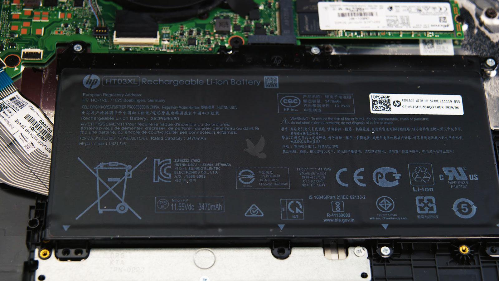 Laptop-Battery-Replacement Open laptop with the internal battery exposed and ready for removal