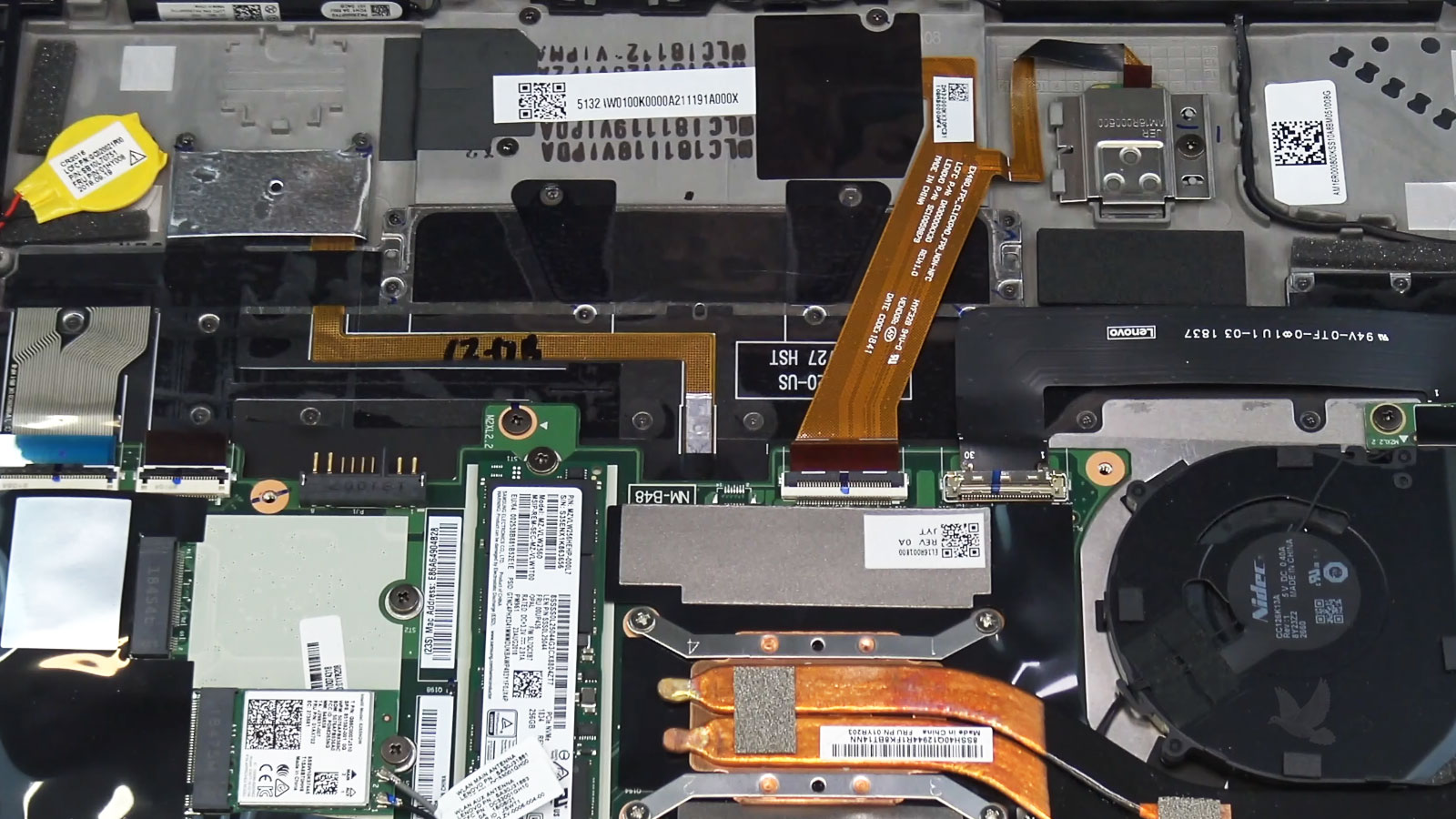 Lenovo-Laptop-Trackpad-Replacement-in-Progress Lenovo laptop disassembled for trackpad repair with internal connector and flex cables exposed