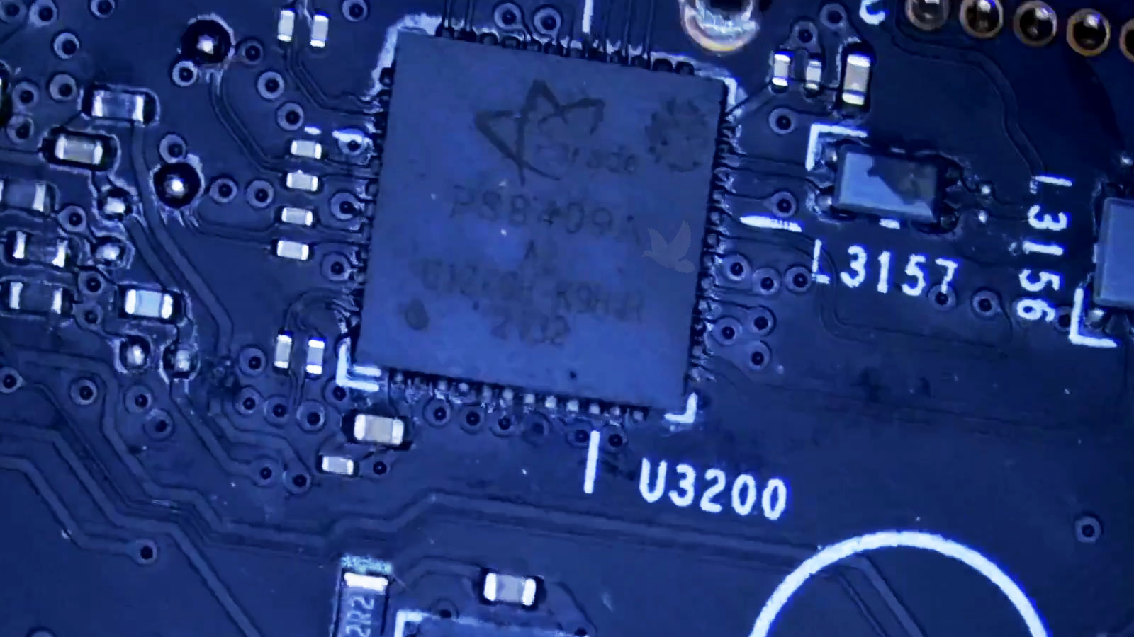 Liquid contamination on the 2R2 resistor next to U3200 during a laptop motherboard repair