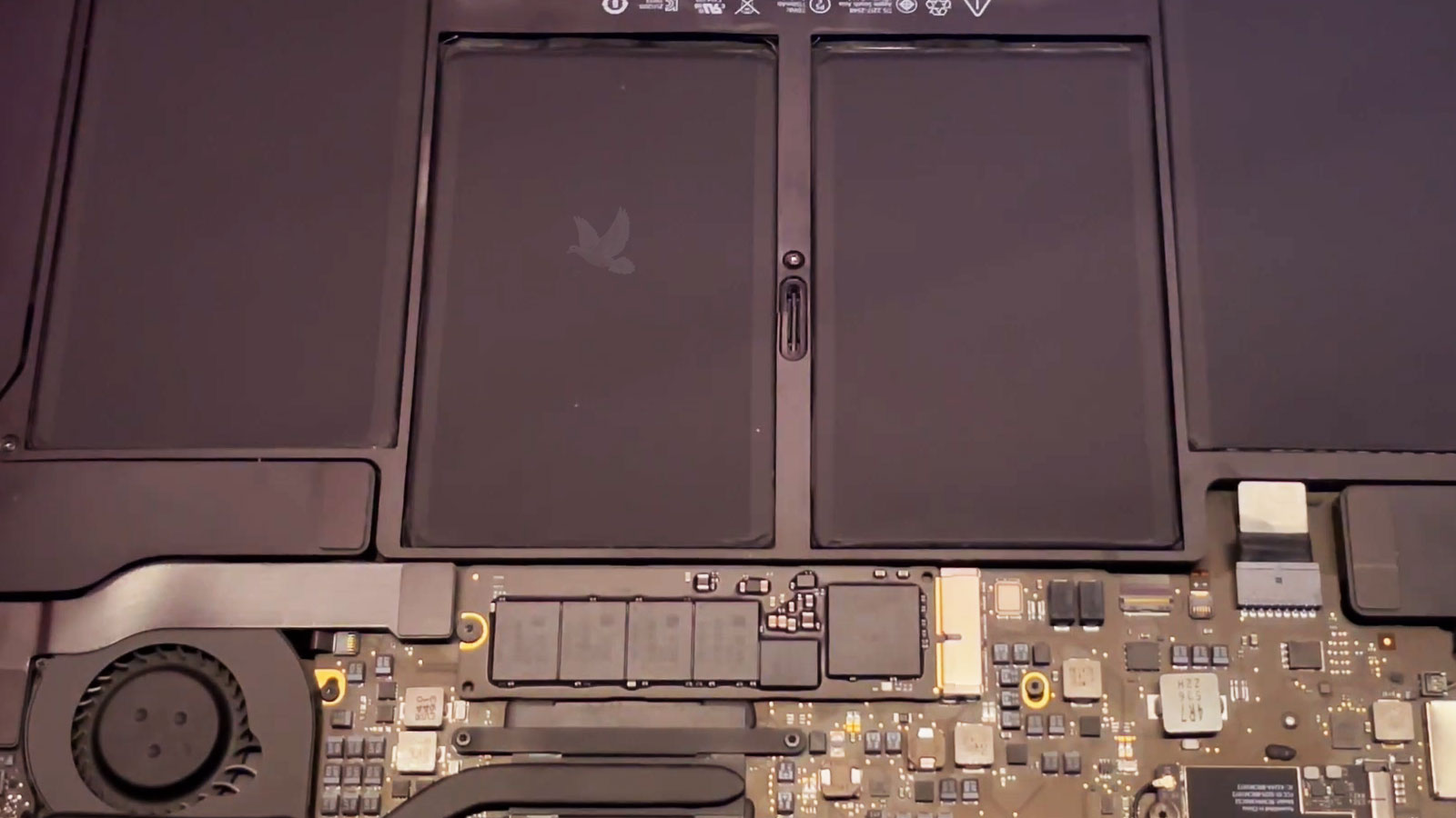 MacBook Air interior after cleaning and maintenance with the CPU cooling fan free of dust buildup