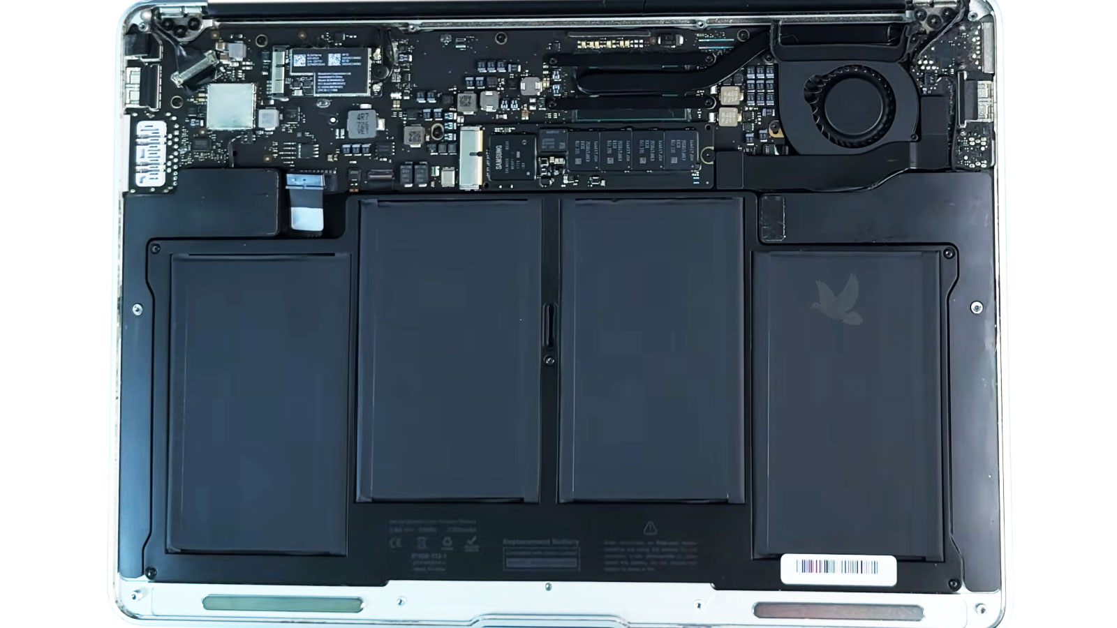 New MacBook Air battery installed with the back cover open for final inspection
