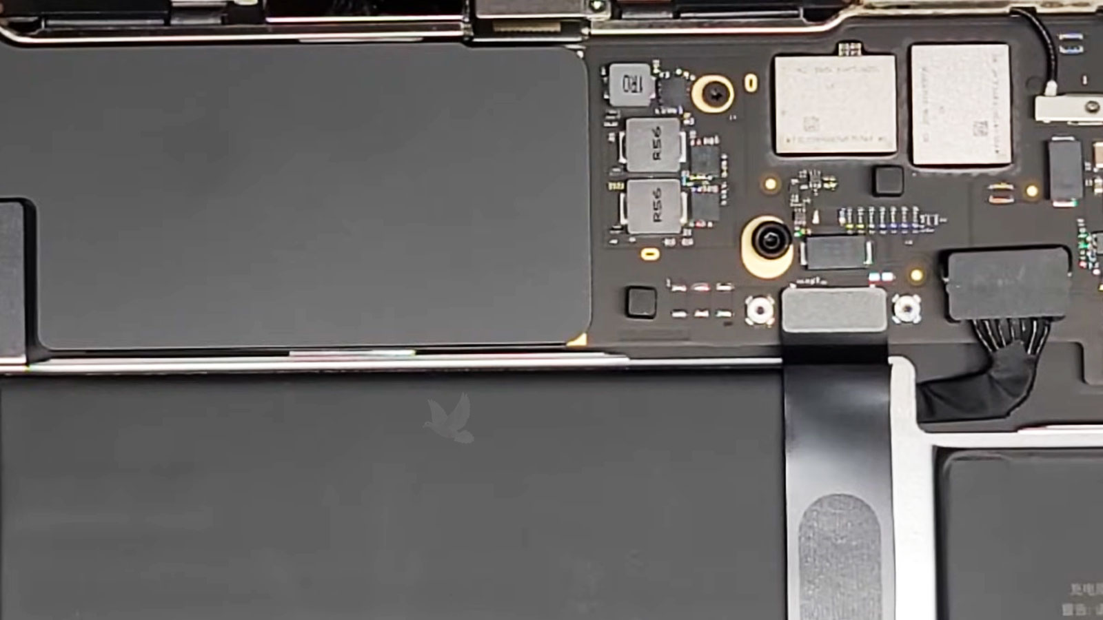 MacBook-Air-Logic-Board-Diagnostic-in-Progress MacBook Air opened for diagnostics with the logic board, battery connector, trackpad cables, and internal components exposed