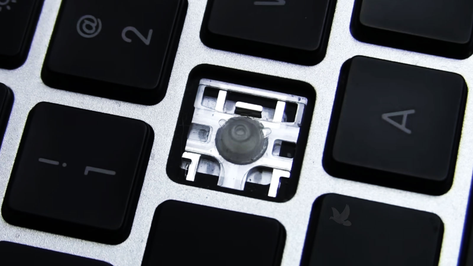 MacBook Pro keyboard with a missing key requiring individual key replacement