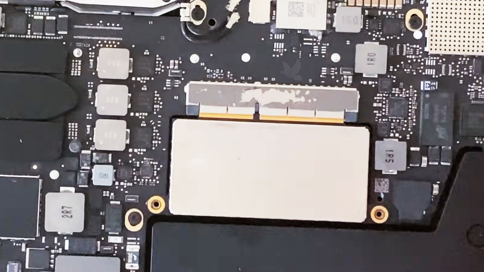 MacBook Pro logic board with removable SSD ready for extraction during data recovery