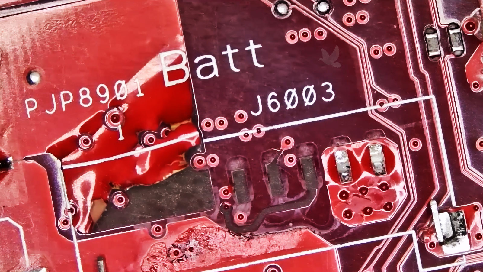 Laptop motherboard with battery connector ripped off and missing PCB pads and traces