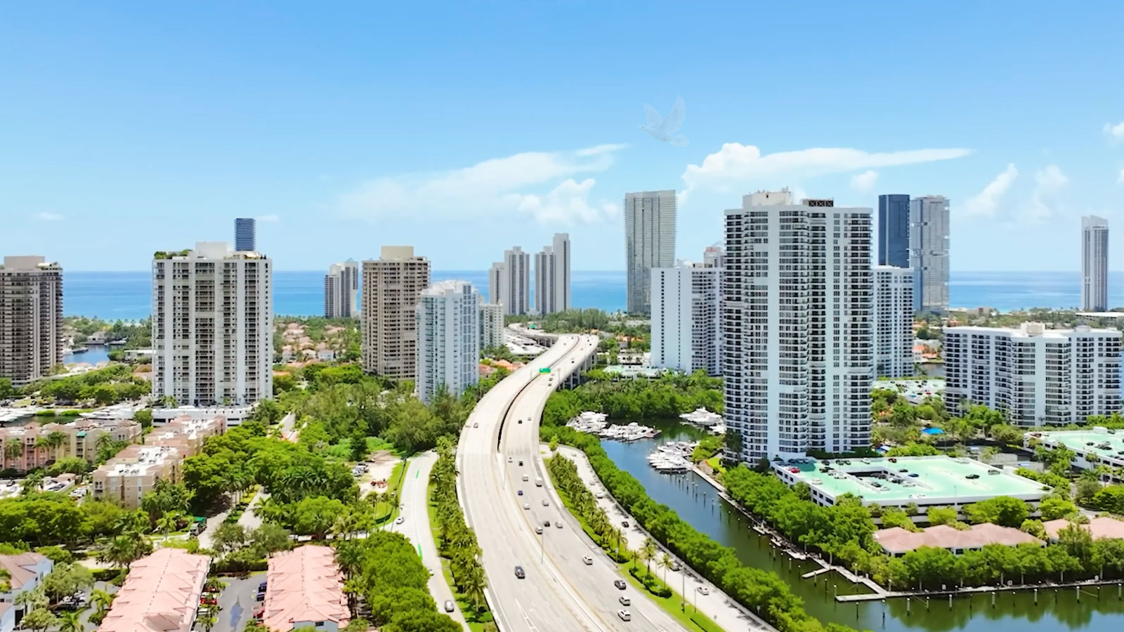 Highway through central Aventura Florida with high-rise buildings