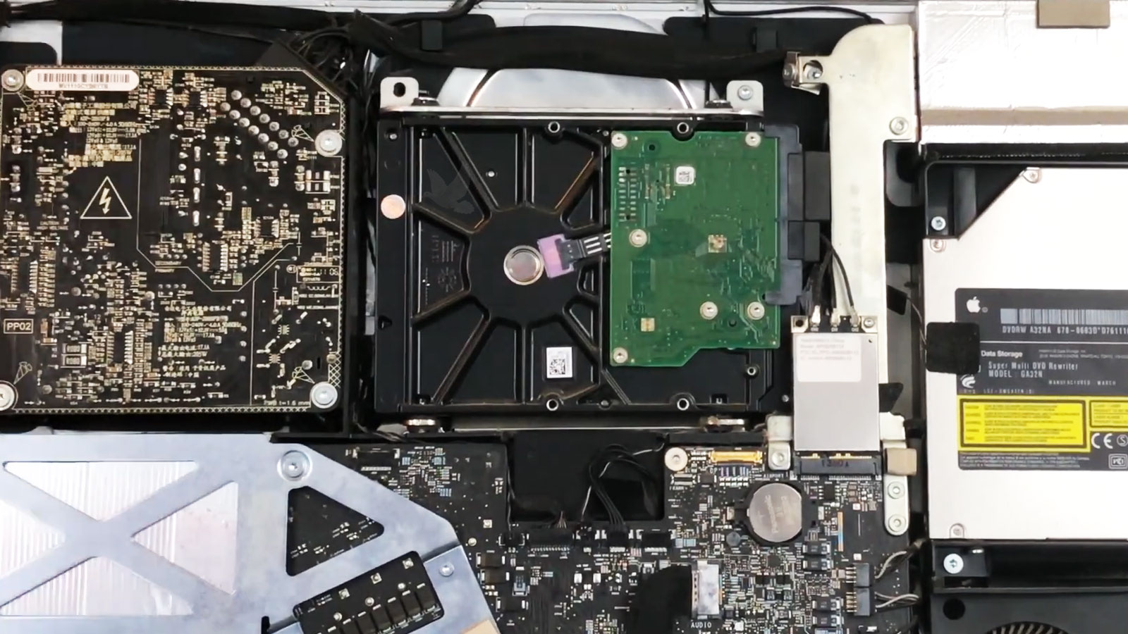 Open iMac showing the original 3.5-inch hard drive and internal components before data recovery