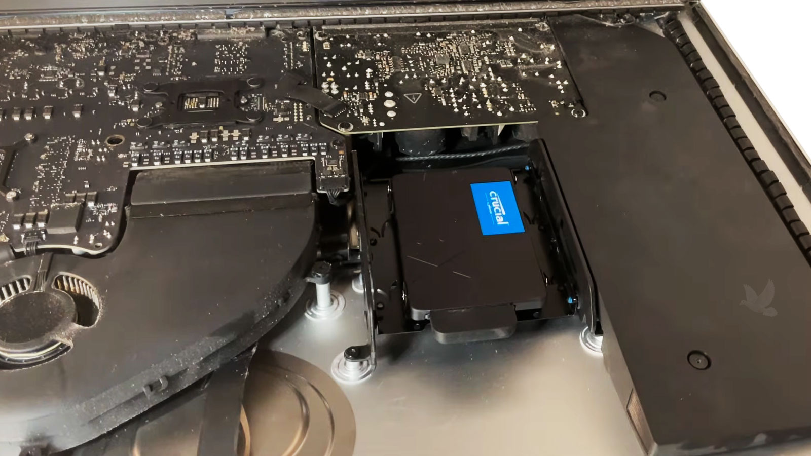 Open iMac upgraded from its original hard drive to a Crucial BX series solid-state drive