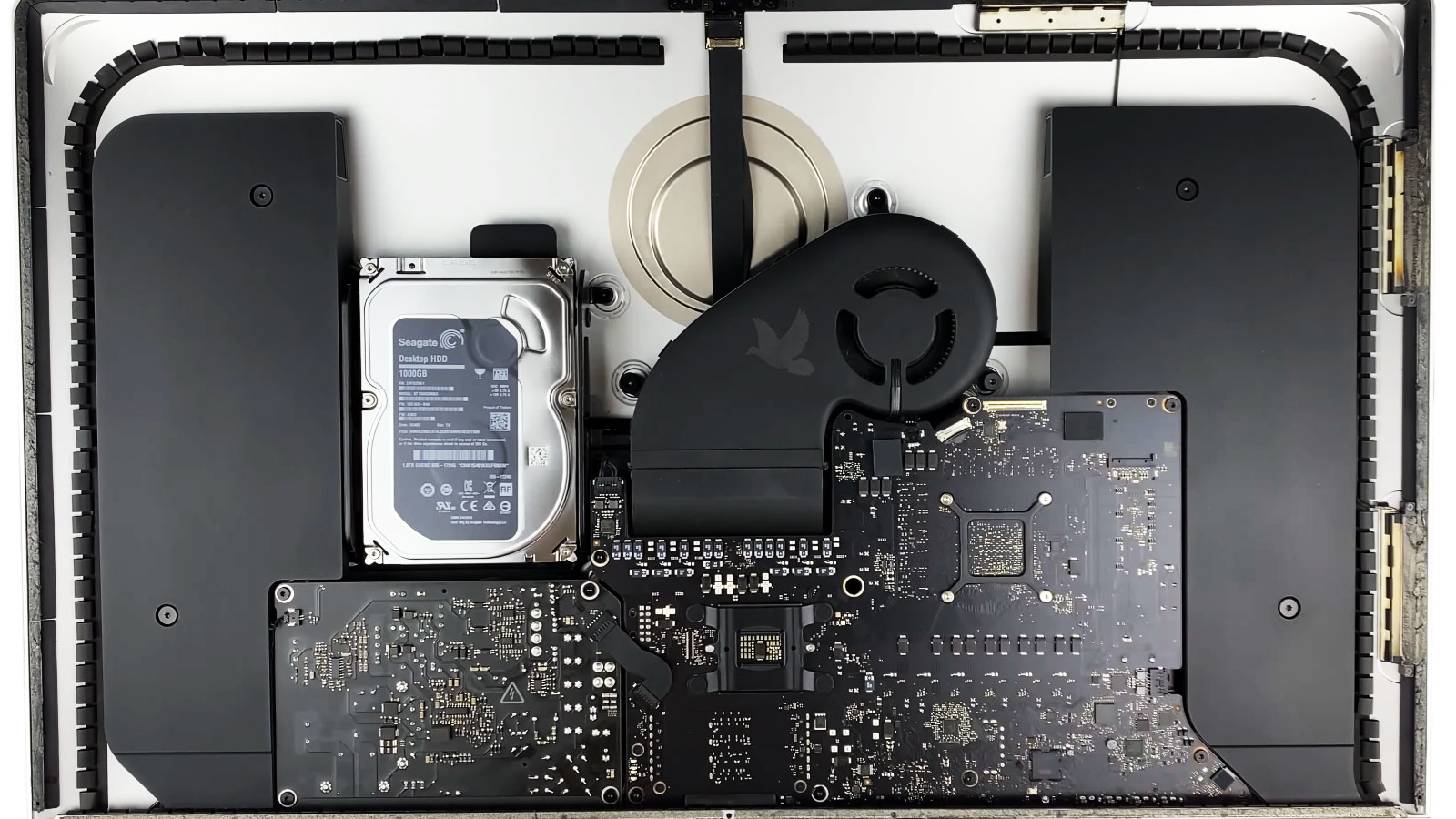 Open iMac with the repaired power supply reinstalled during final reassembly