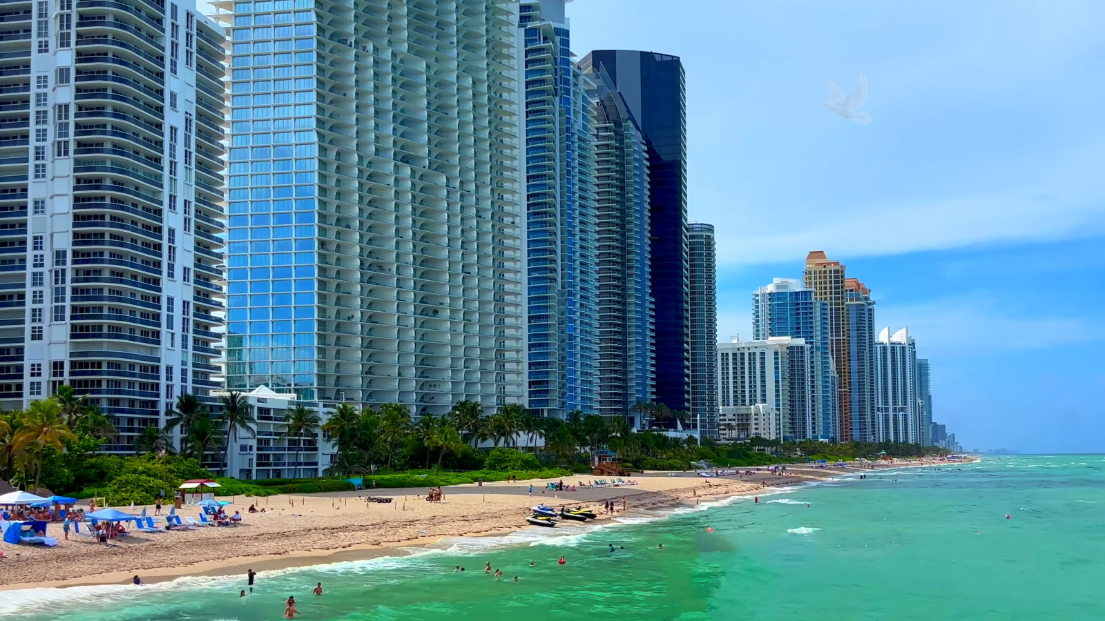 Sunny Isles Beach shoreline with oceanfront high-rise buildings