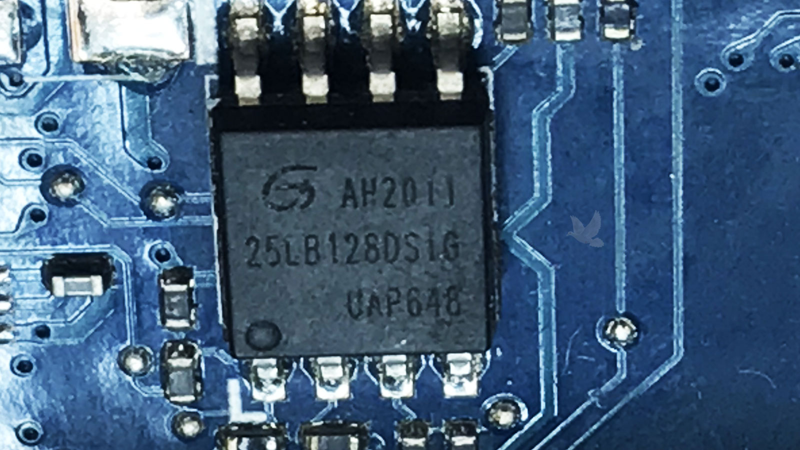 Circuit board showing a 21LB128DSLG integrated circuit with an internal short circuit requiring chip replacement.