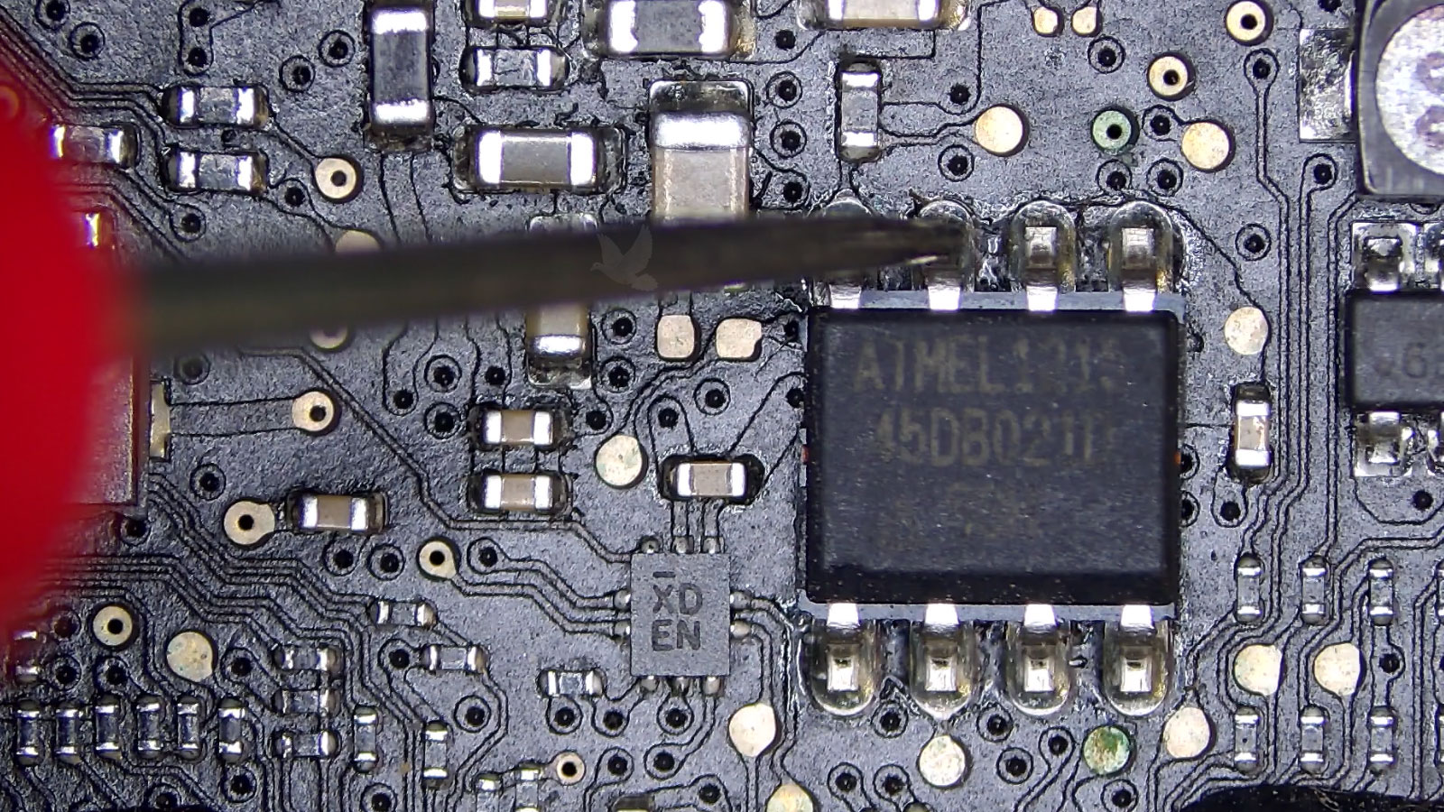 Resistance measurement on the second pin of an 8-pin IC showing a low reading close to ground