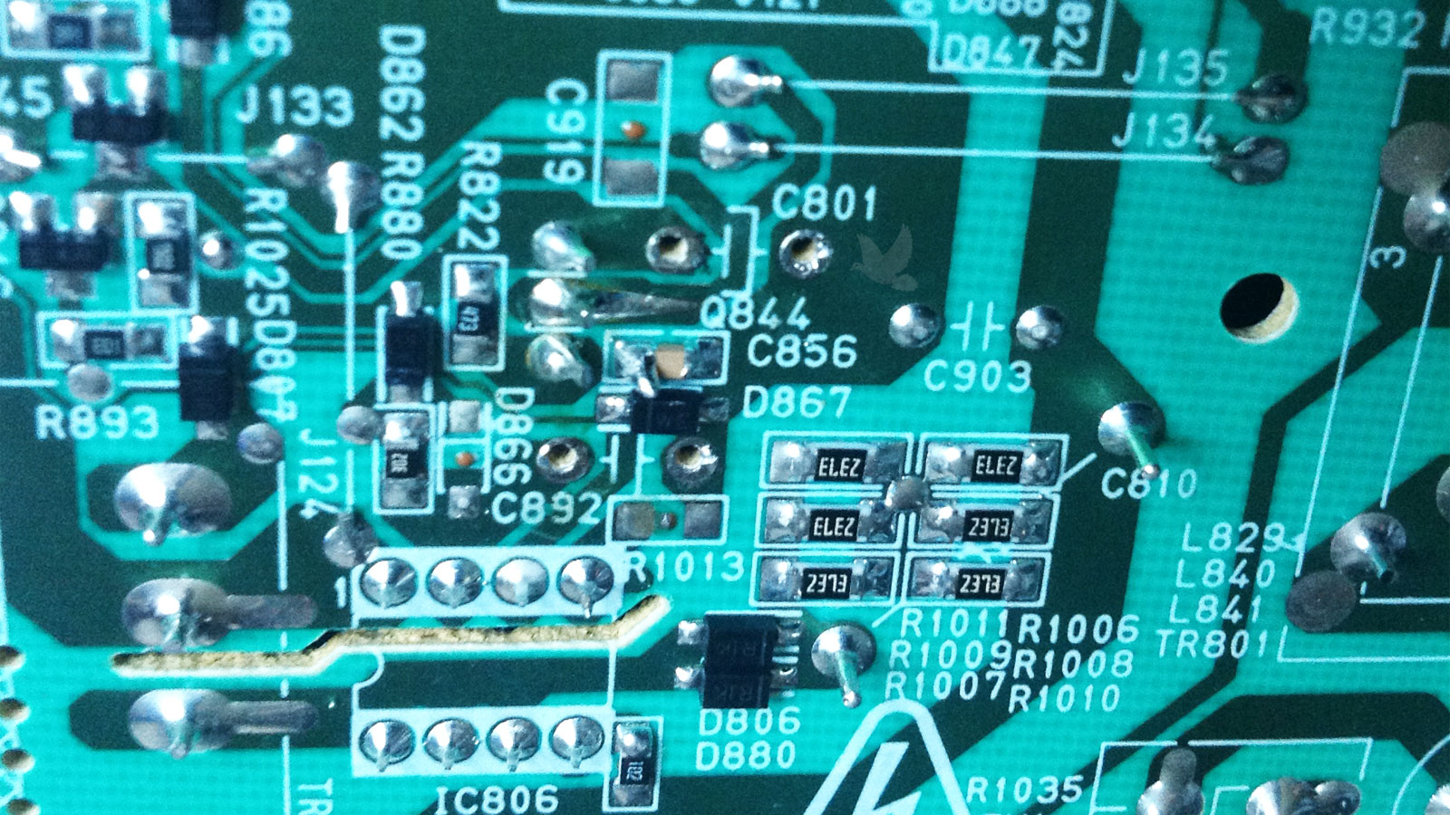 Circuit board solder joints resoldered with C801 capacitor removed for replacement