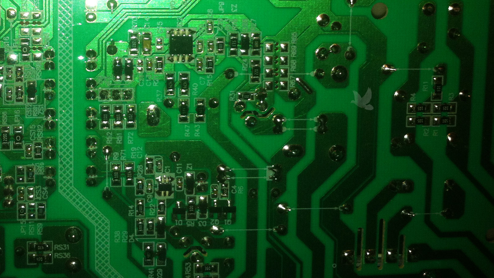 Circuit board repaired by resoldering cracked solder joints on back of board
