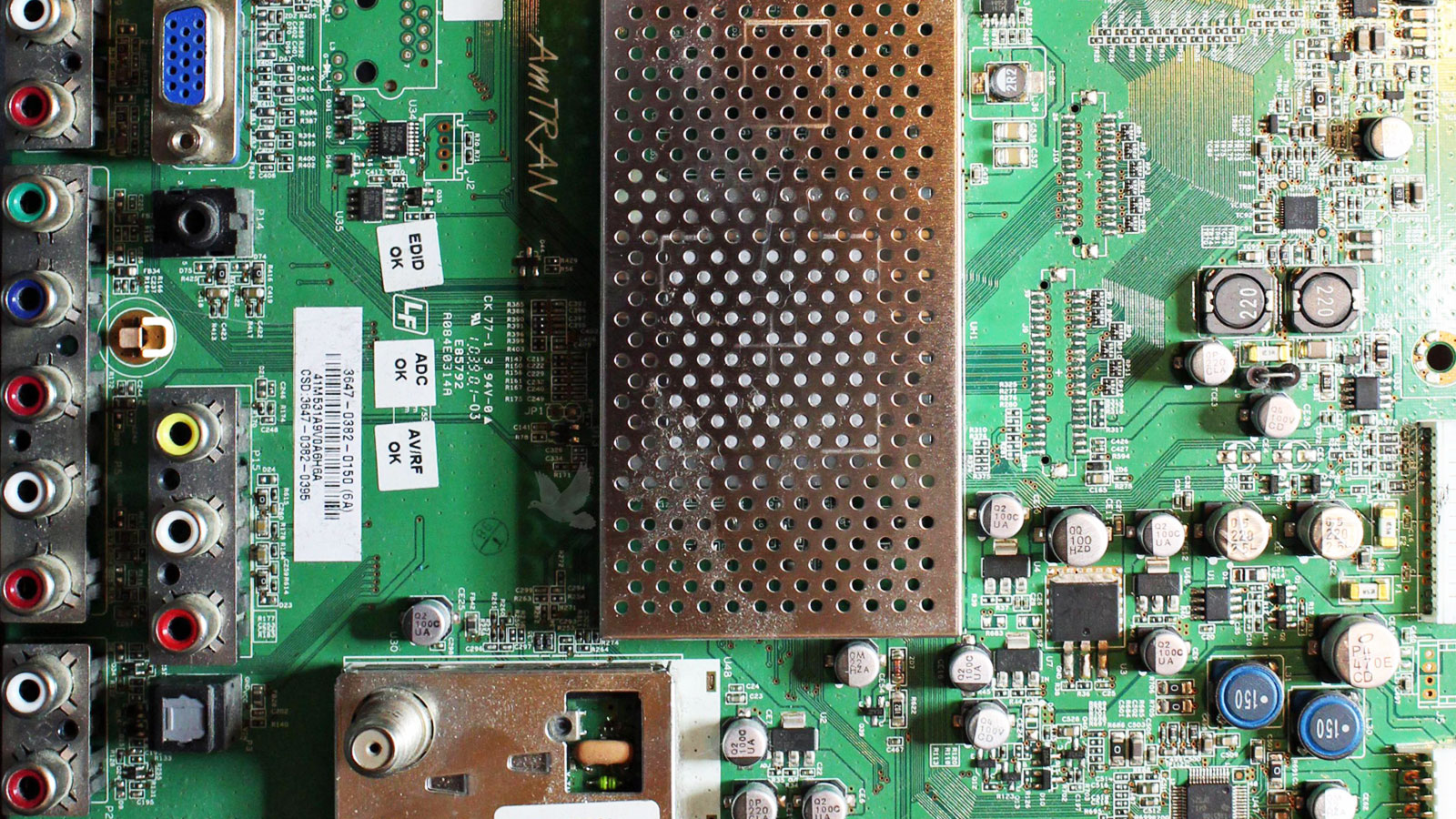 Circuit board with a damaged transistor on the right-hand side and an open zero-ohm resistor, both repaired to restore normal operation.