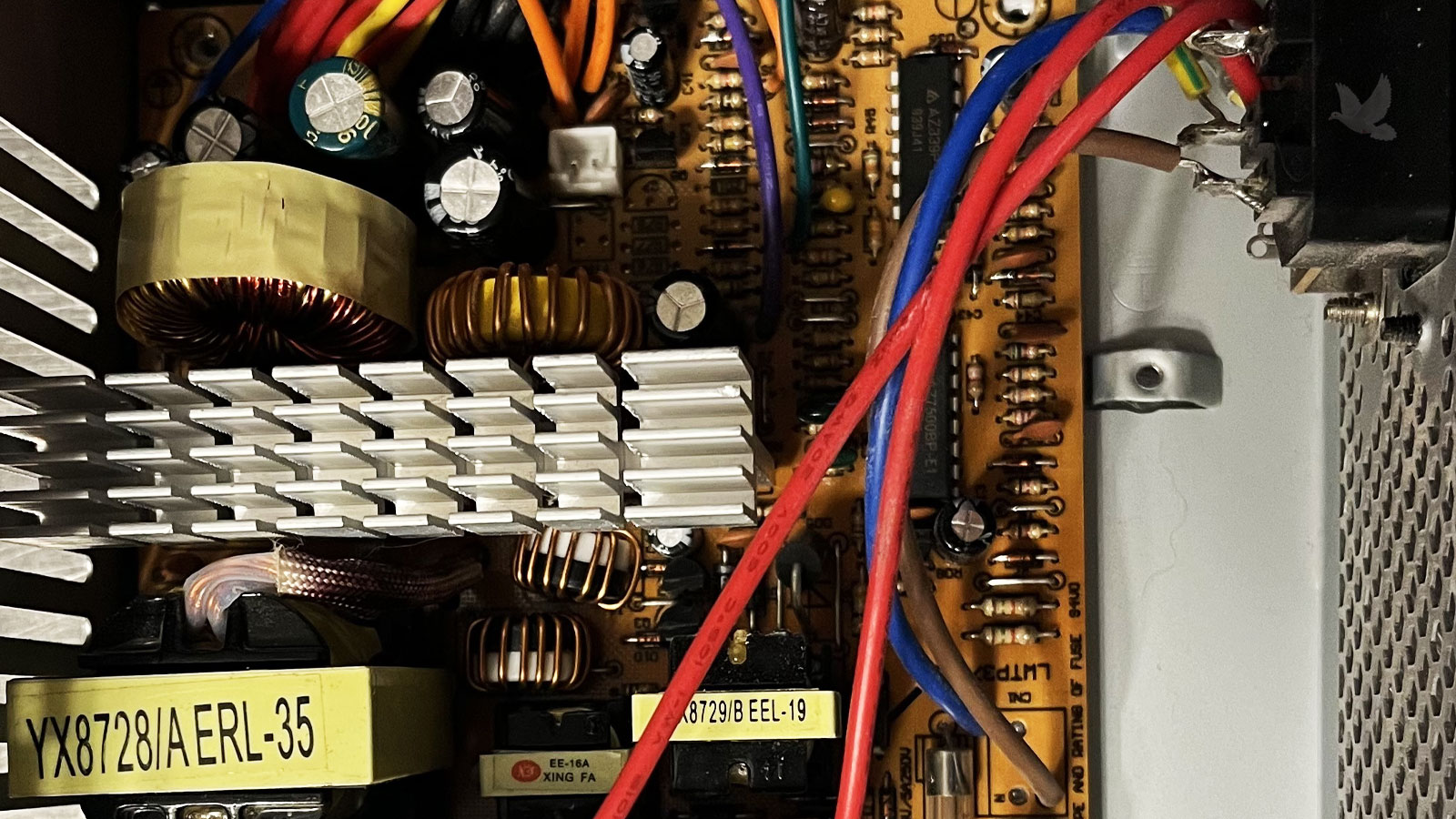 Computer power supply circuit board showing a YX8728/A ERL-35 transformer associated with a faulty power rail and startup failure.