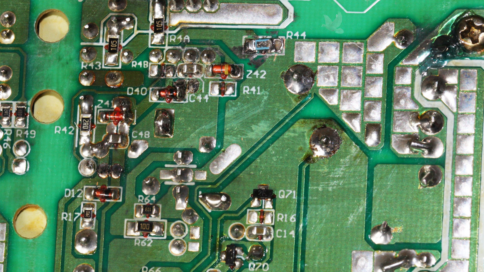 Damaged R44 resistor with missing material next to Z42 diode on circuit board