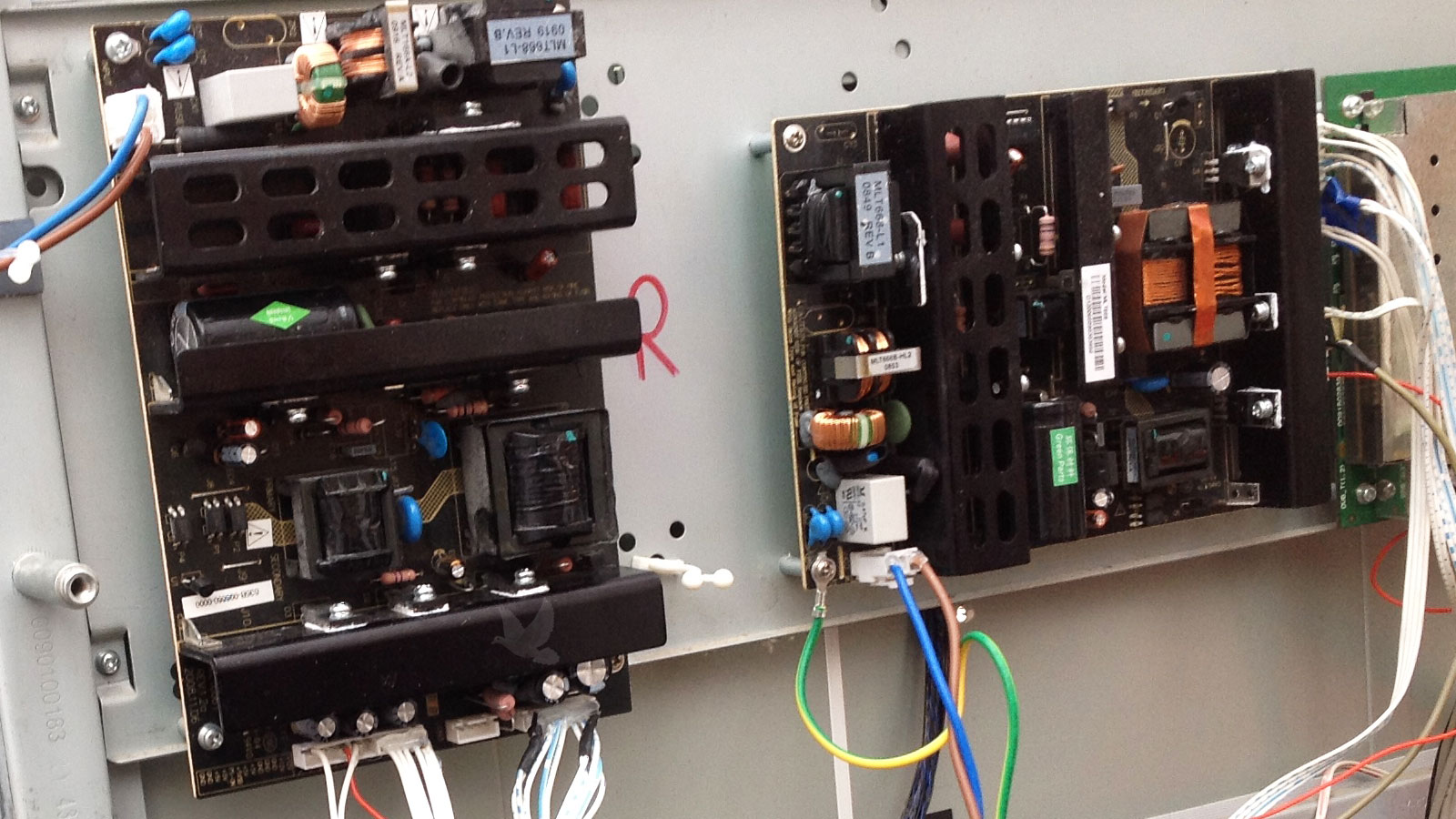 Two power circuit boards with electrical short detected on right-side board
