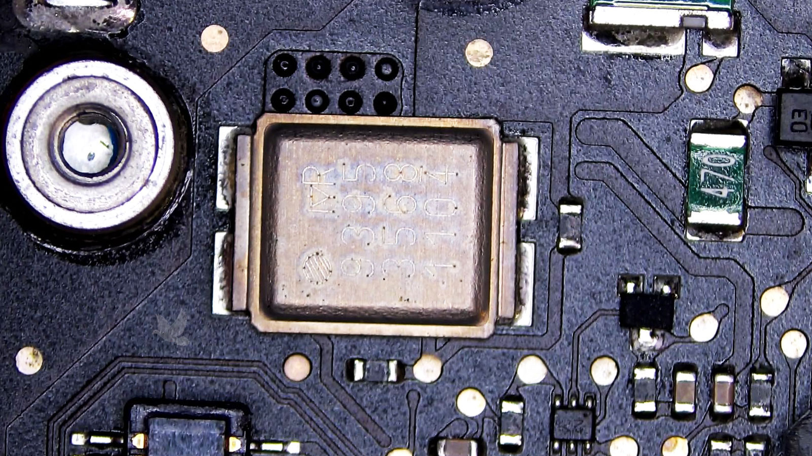 Failed small transistor beside IC chip marked 939535681104