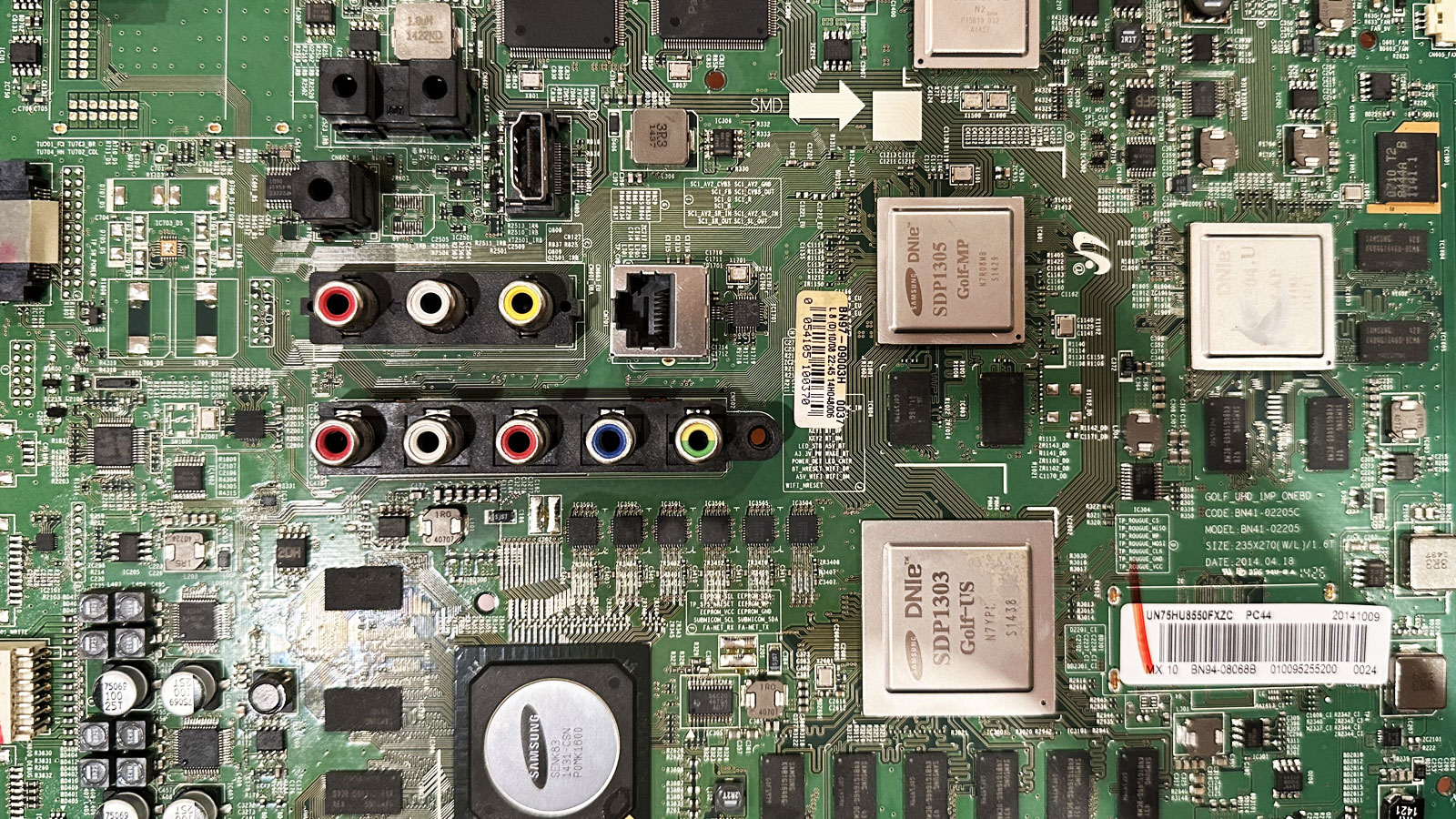 Circuit board HDMI connector being inspected for physical damage and possible faults in the HDMI power rails and signal lines.