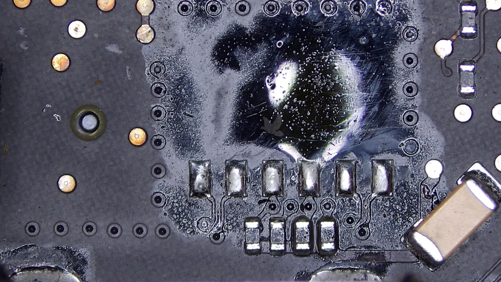 Circuit board area showing discoloration from prolonged heat and thermal stress