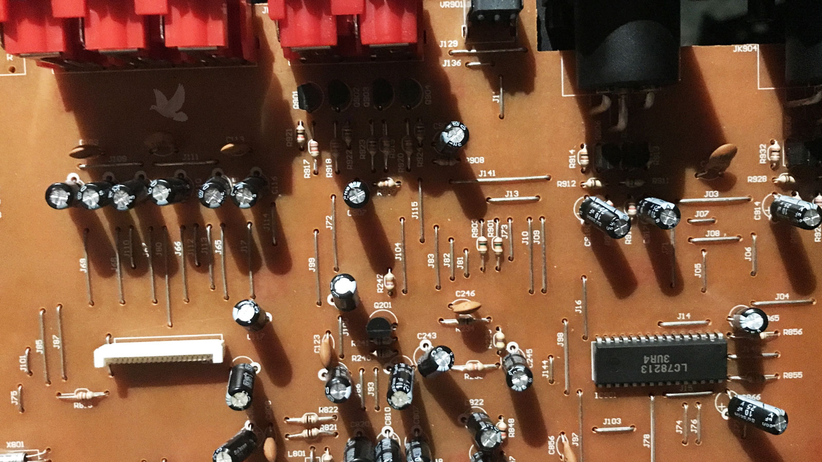 Circuit board showing a newly installed LC78213 3UR4 integrated circuit replacing a defective component that had stopped functioning