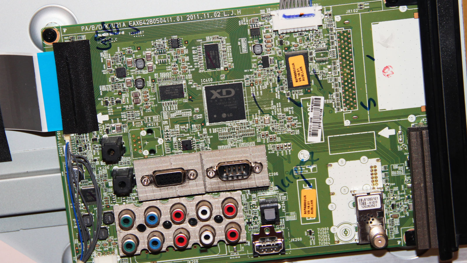 LG television circuit board showing a failed main processor chip with suspected heat-related damage after prolonged operation.