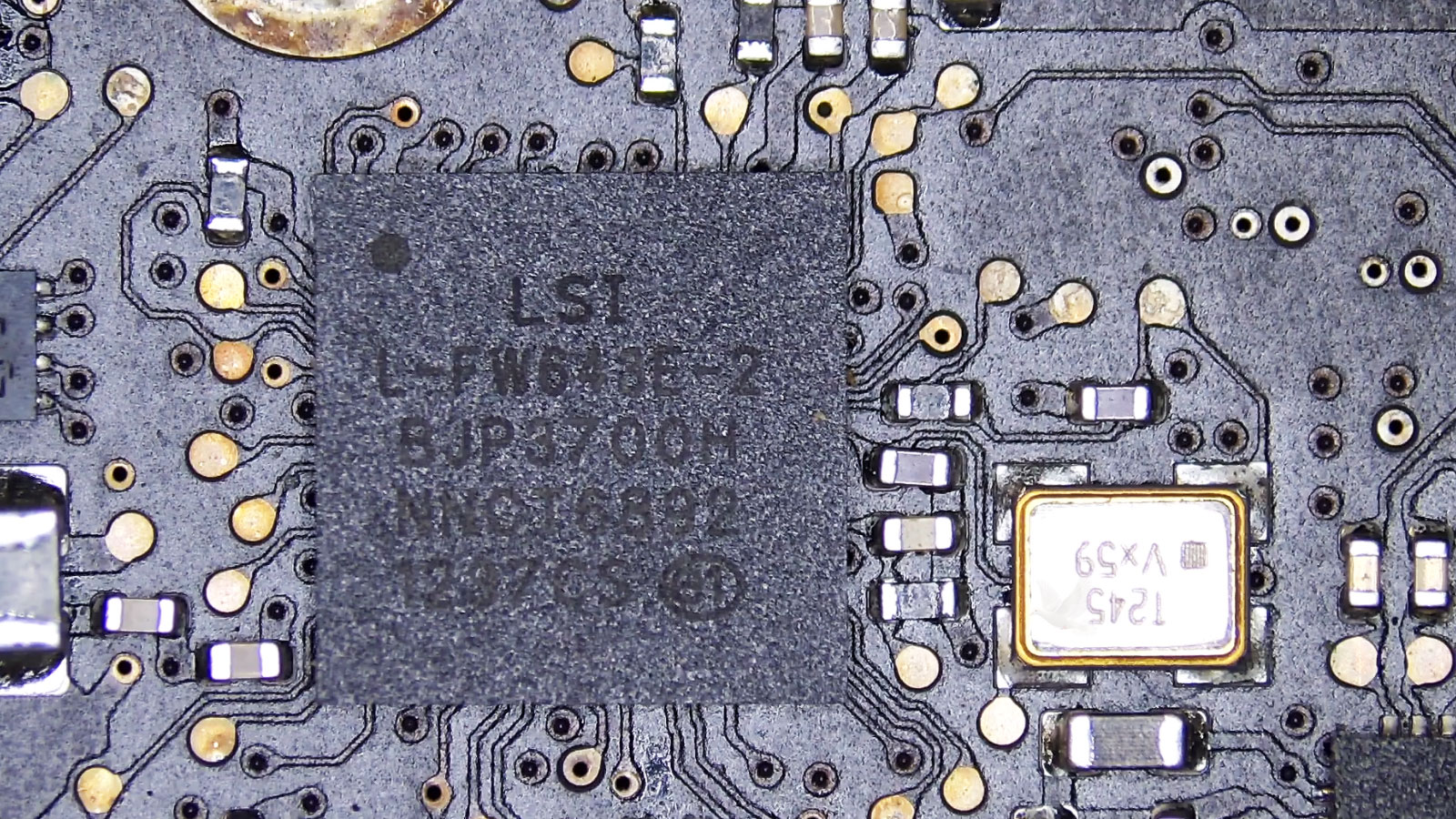 Shorted capacitor next to an LSI chip identified as the cause of overheating