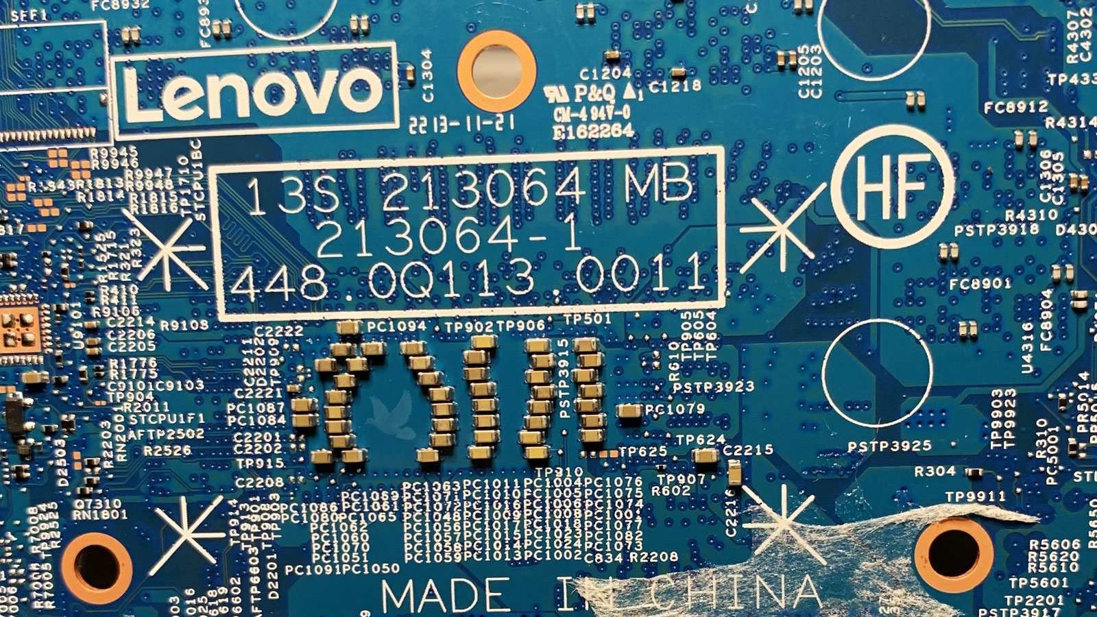 Lenovo 13S 213064 motherboard with shorted capacitor among parallel capacitors behind CPU area
