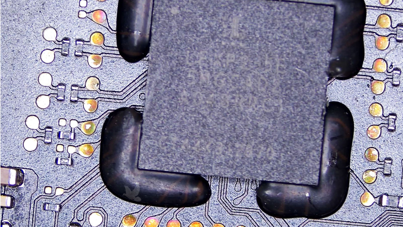 Main IC chip secured with hardened silicone and surrounded by resistors with open and out-of-spec components