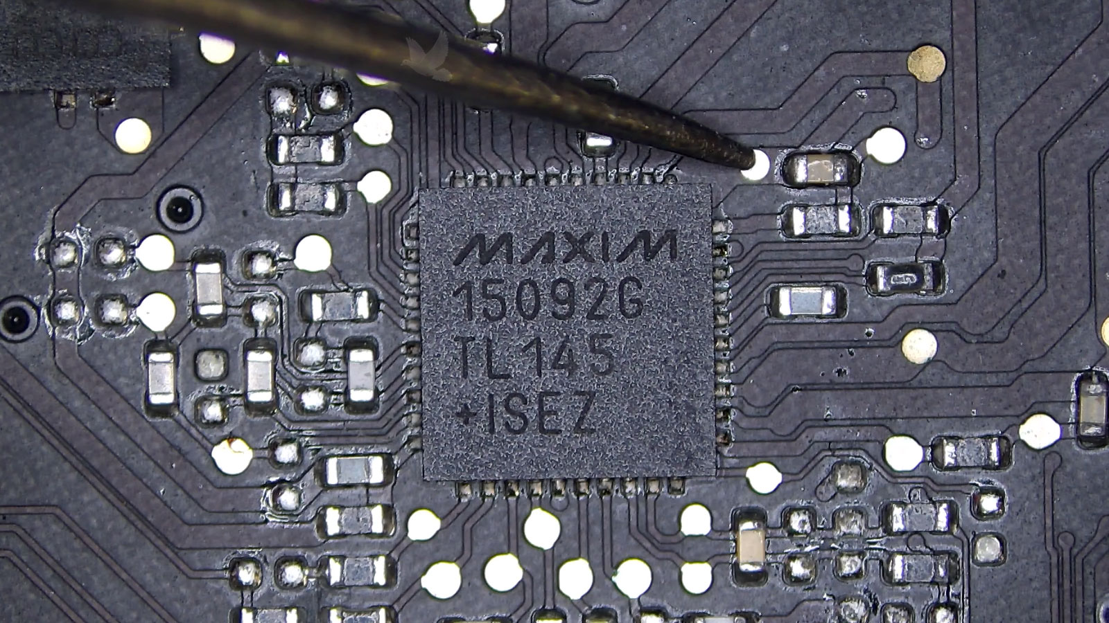 Damaged overheated capacitor connected to Maxim IC chip