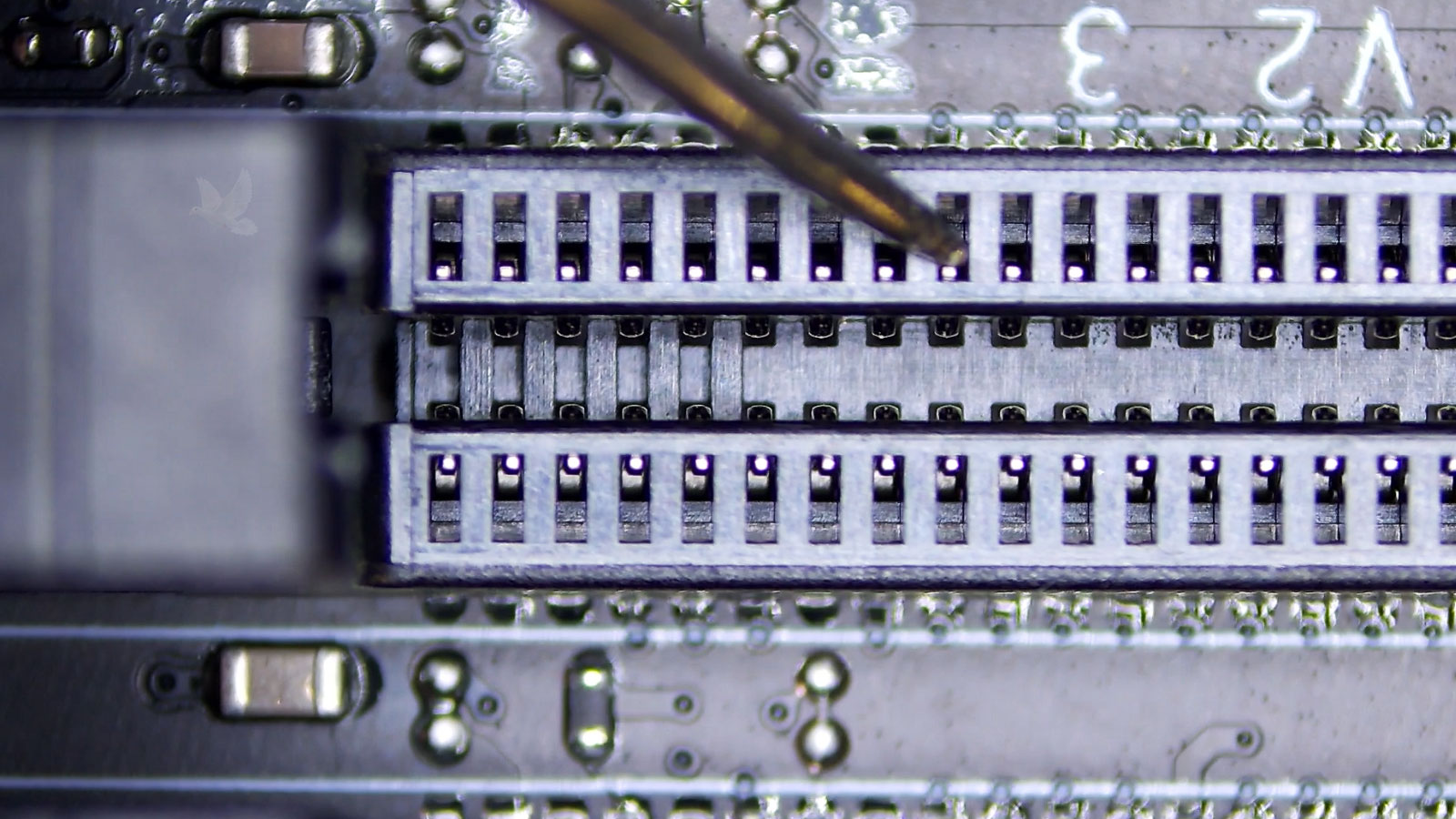 PC memory socket pin being measured during diagnosis of a contact failure