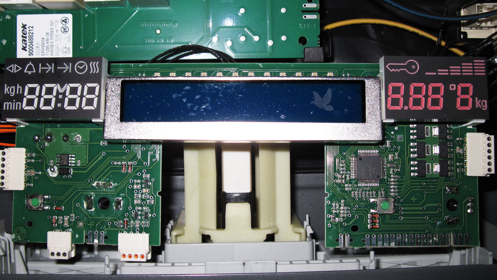 Electronic device featuring three small LCD screens, including a long central display and two smaller displays on either side, illustrating the difficulty of finding compatible replacement screens.