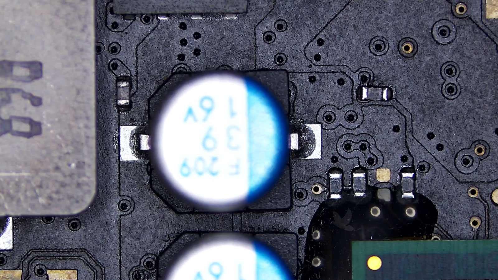 Tiny open resistor beside a 16-volt capacitor causing a circuit failure