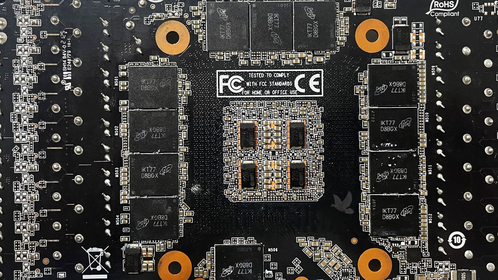 Rear side of a PCIe graphics card showing numerous electronic components that require inspection during board-level diagnostics.