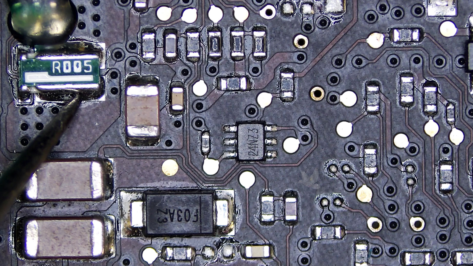 R005 current sense resistor being measured with no voltage present on a computer circuit board